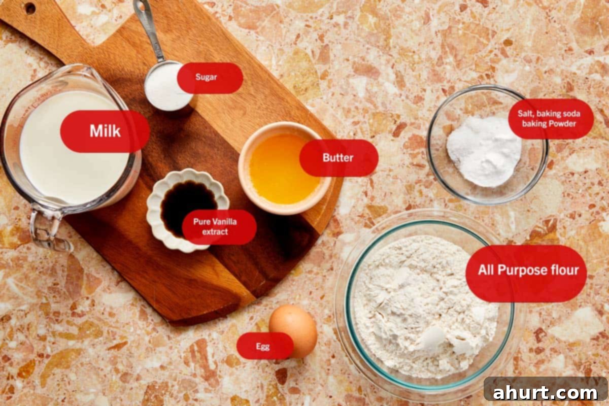 The Ultimate Paffles Waffle Pancake Perfection 3 Ingredients for Wancakes displayed on a table, including flour, sugar, eggs, and butter, ready for baking.