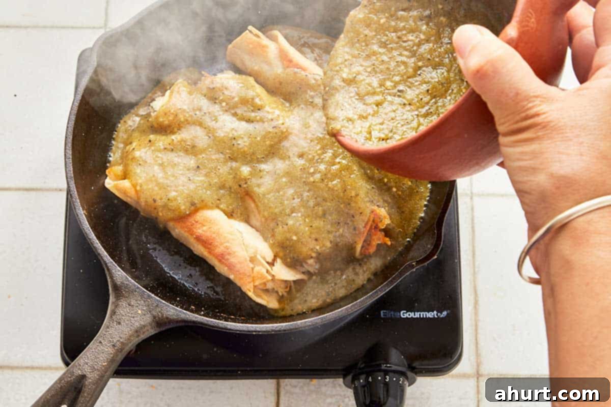 Green Enchiladas 8 A cook adds green salsa to enchiladas in a skillet, ready to cover and simmer for seven minutes.