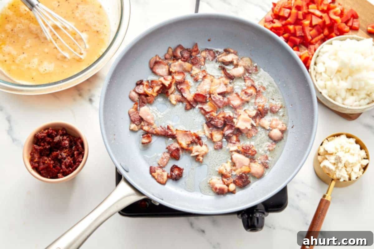 Frittata The Brunch Showstopper 6 Finely chopped onions and diced red bell peppers are actively sautéing in a skillet, softening and becoming translucent in the savory bacon grease, releasing their sweet aromas.