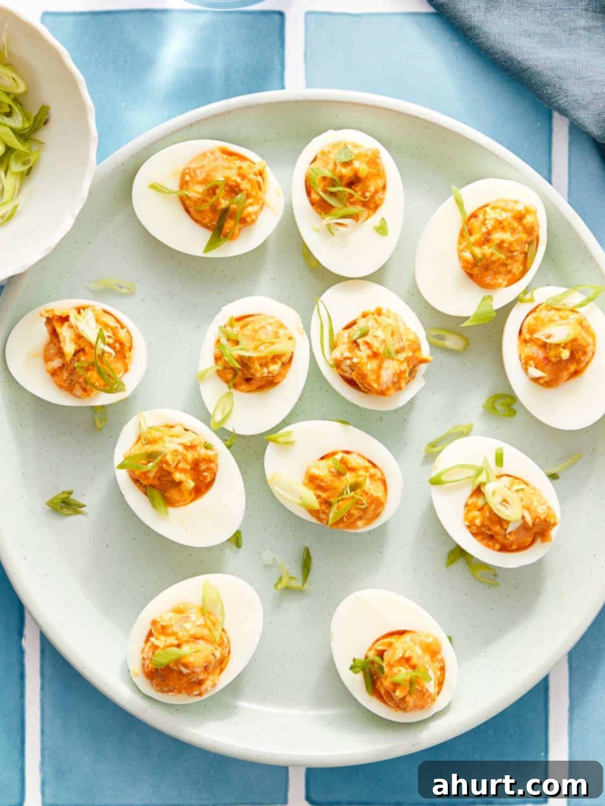 Spicy Buffalo Chicken Deviled Eggs 2 Overhead of buffalo chicken deviled eggs on a platter.