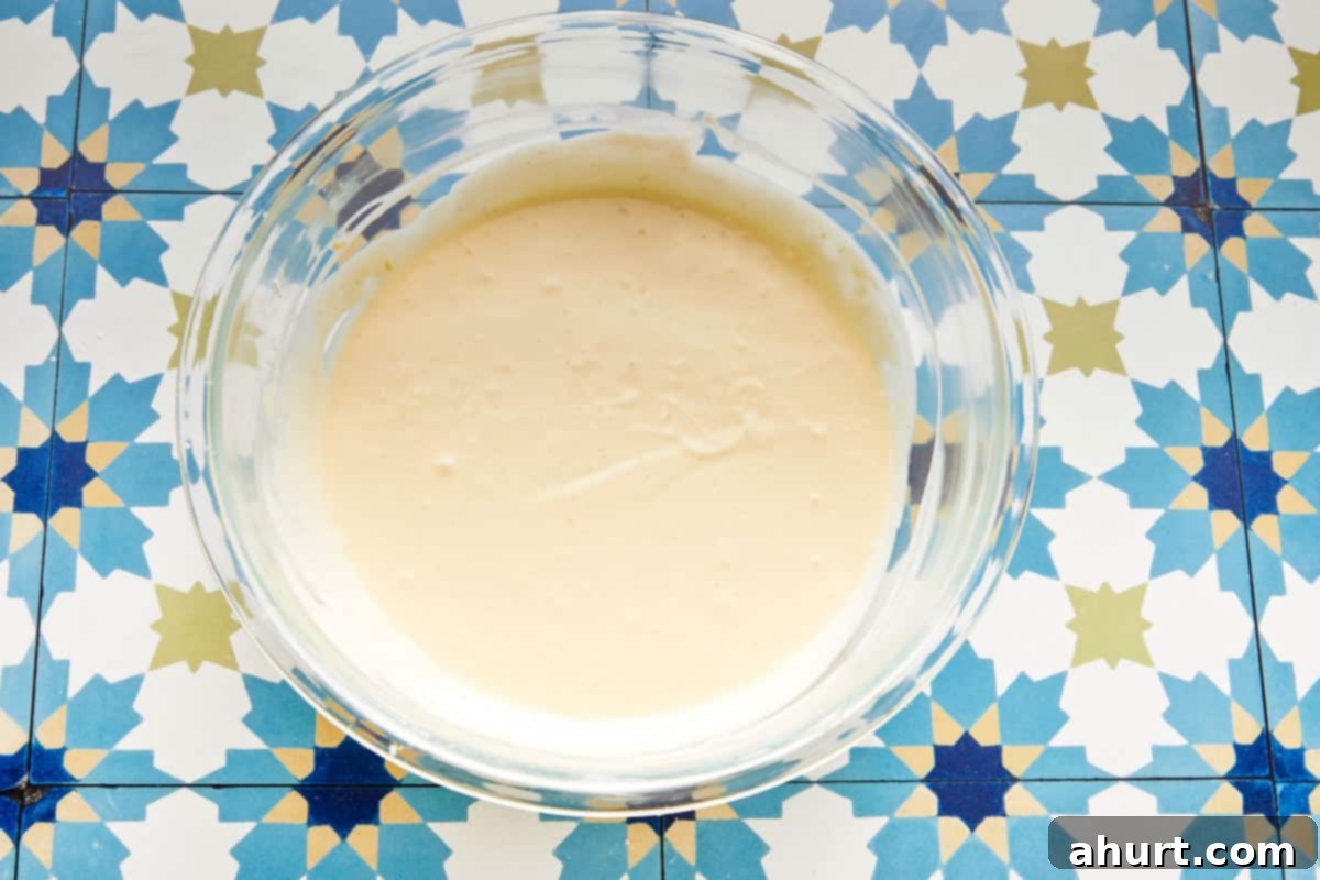 Burnt Basque Cheesecake 7 Cheesecake batter whisked smooth in a glass bowl