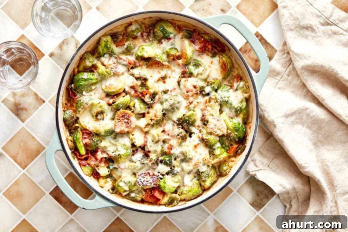 Smoky Bacon Brussels 11 Baked creamy garlic parmesan Brussels sprouts with bacon, bubbling hot and golden brown from the oven, ready to serve.