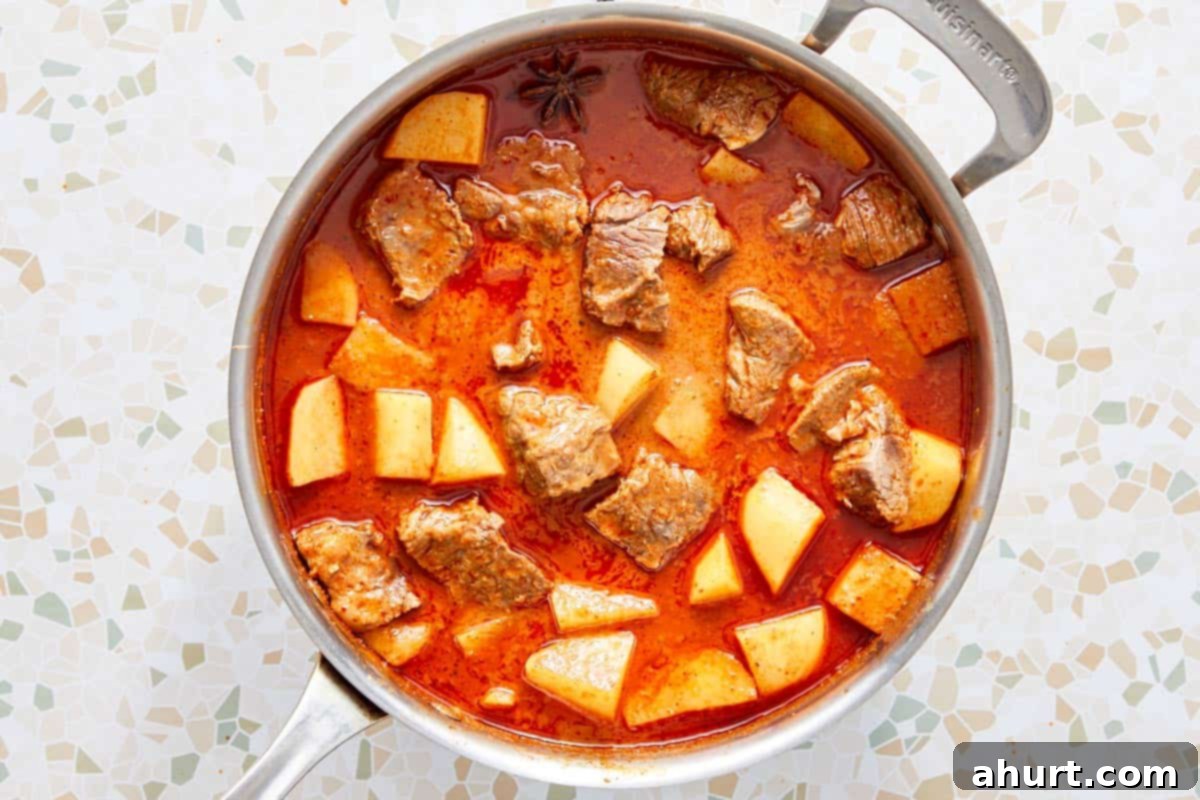 Rich Massaman Beef Curry 8 Tender beef and potatoes simmering in the rich, golden Massaman curry sauce.