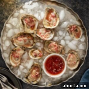 A selection of three oyster preparations, featuring Asian-style with roe, bacon-topped baked oysters, and classic mignonette.