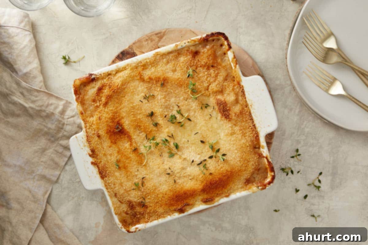 The Shepherd’s Pie, fresh from the oven, showcasing a perfectly crisp and golden mashed potato topping, ready to be served.