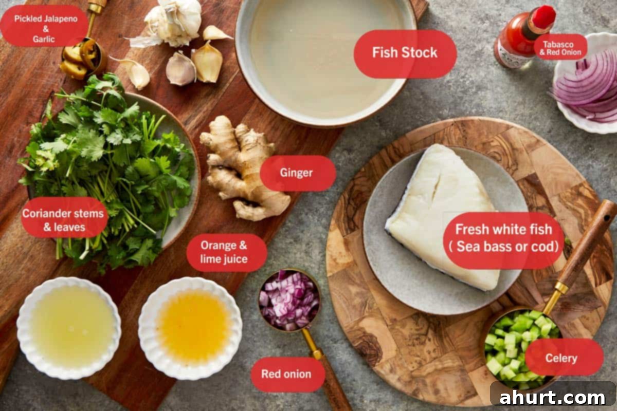 Ceviche ingredients arranged on a board with fish, vegetables, citrus, and stock.