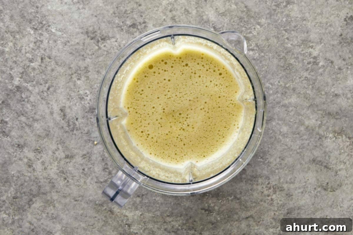Smooth blended marinade mixture inside a blender jar.