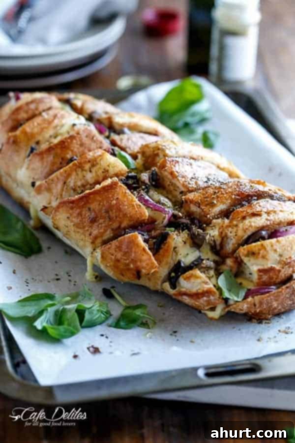 Loaded BBQ Chicken Pizza Pull-Apart Bread 2 Top view image of Barbecue Chicken Pizza Stuffed Bread, golden brown and garnished.