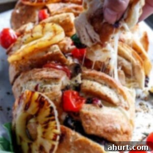 Loaded BBQ Chicken Pizza Pull-Apart Bread 12 Barbecue Chicken Pizza Stuffed Pull Apart Bread on a baking tray