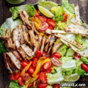 Refreshing Grilled Tequila Lime Chicken Taco Salad with avocado and a zesty dressing, a healthy and flavorful option