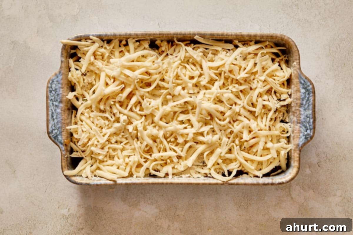 Layer topped with shredded mozzarella before baking.