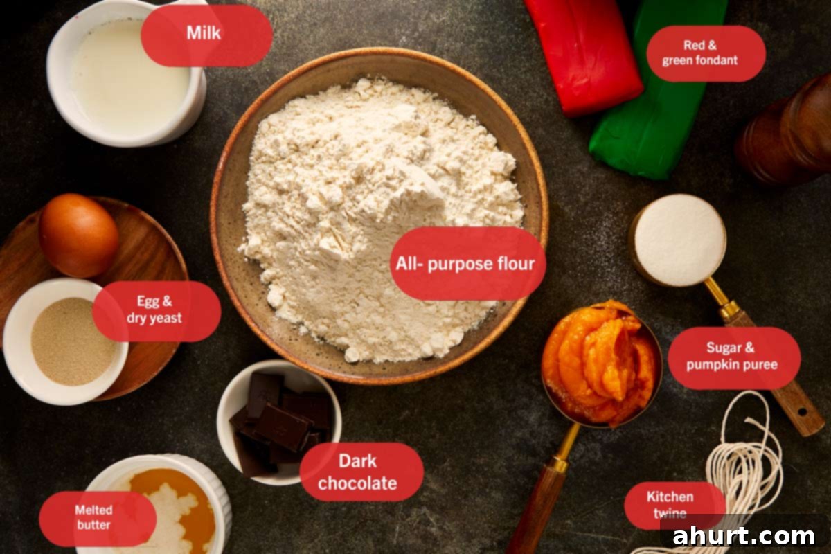 Ingredients for pumpkin breads laid out on a dark surface, including flour, pumpkin purée, milk, chocolate, butter, egg, yeast, sugar, and fondant.