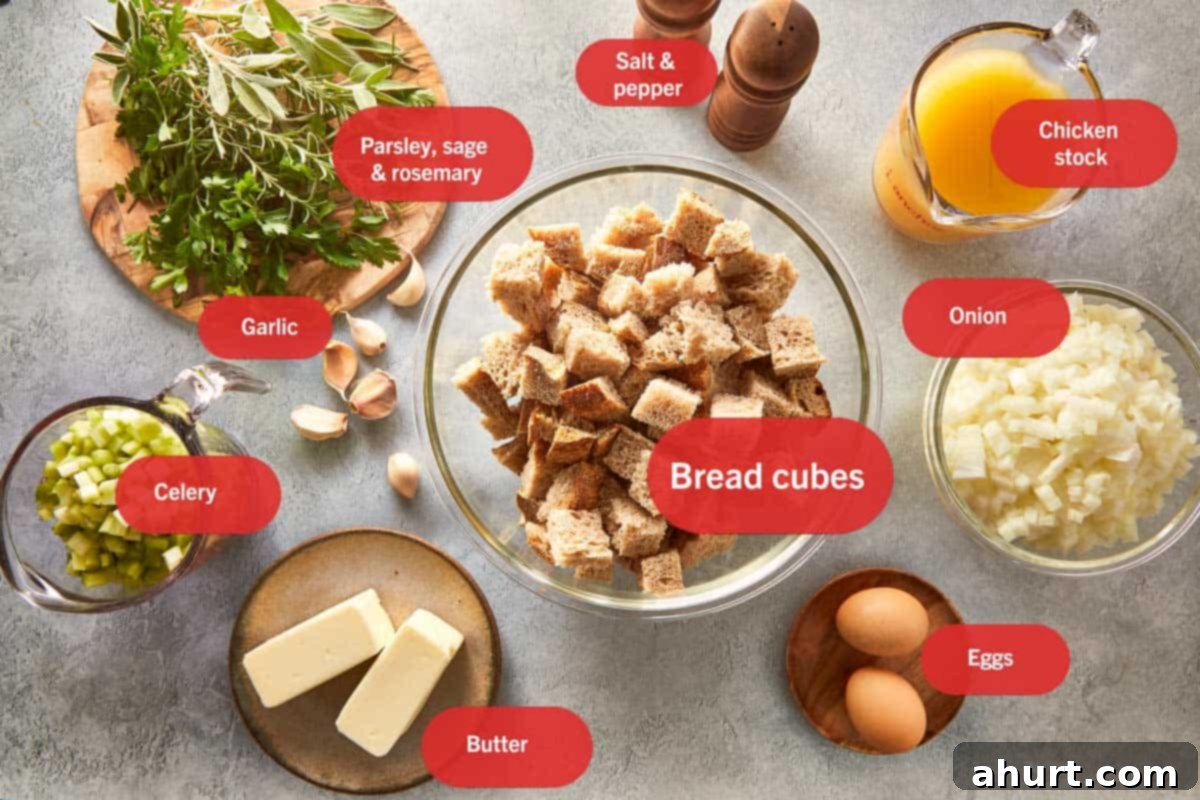 Classic Buttery Herb Stuffing 3 All the ingredients for classic buttery herb stuffing laid out: bread cubes, fresh herbs, butter, eggs, chopped onion, celery, garlic, chicken stock, salt, and pepper labeled clearly on a light surface.