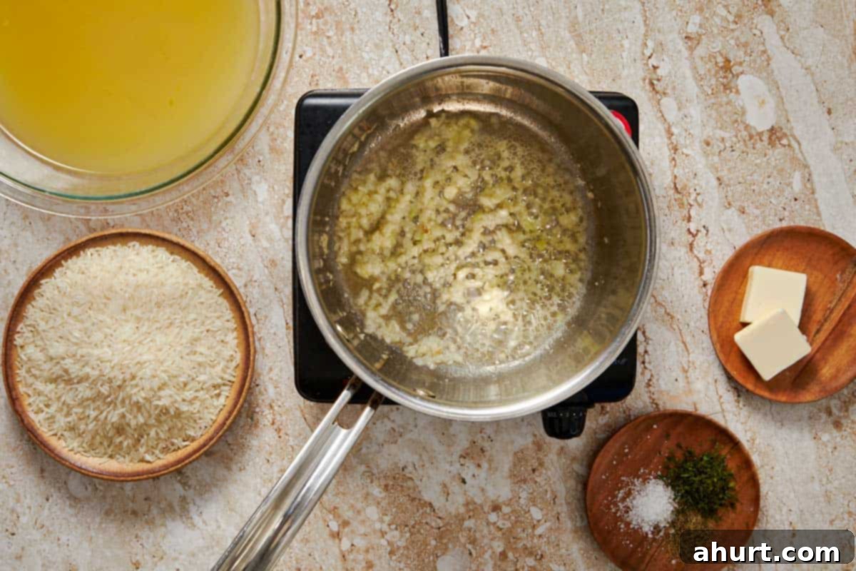 Simple and Flavorful Garlic Butter Rice 4 A pot on a stove with butter melting and minced garlic being sautéed, creating an aromatic base.