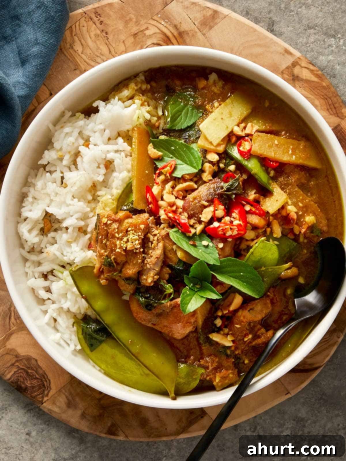 top down shot of a thai green chicken curry in a bowl