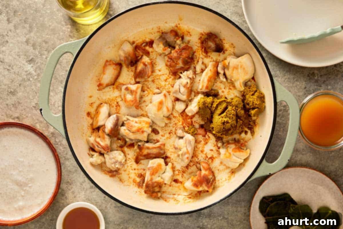 top down shot of a pan with chicken thigh cooked