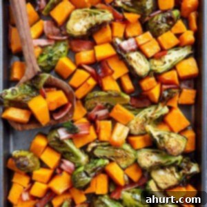 Master Your Thanksgiving 30 Recipes for a Perfect Feast 17 A vibrant platter of Honey Roasted Butternut Squash & Brussels Sprouts with crispy bacon, showcasing a perfect blend of sweet and savory flavors.