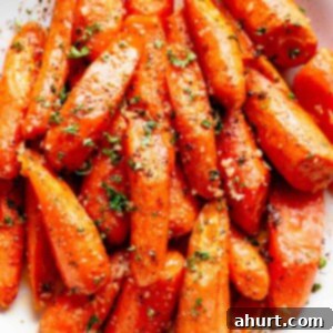 Master Your Thanksgiving 30 Recipes for a Perfect Feast 18 A delectable side view of honey garlic butter roasted carrots, glistening and perfectly tender-crisp.