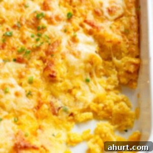 Master Your Thanksgiving 30 Recipes for a Perfect Feast 19 A golden-brown corn casserole, baked until bubbling and topped with melted cheese, served in a classic casserole dish.