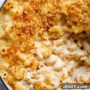 Master Your Thanksgiving 30 Recipes for a Perfect Feast 20 Indulgently creamy Garlic Parmesan Mac And Cheese, topped with golden, crispy breadcrumbs, served in a casserole dish.
