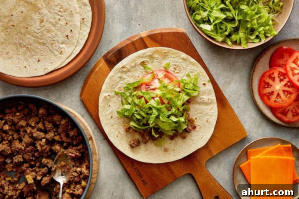 Cheeseburger Bliss Wrap 13 Tortilla wrap with cheese, meat, tomato and lettuce.