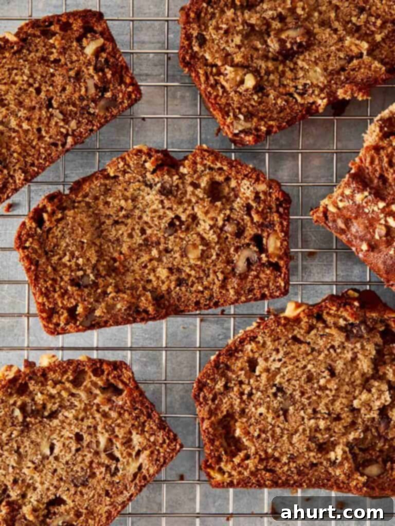 A top-down view of multiple slices of freshly baked banana bread artfully arranged on a serving tray.