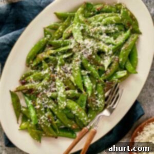 Overhead view of served Cacio e Pepe with Sugar Snap Peas