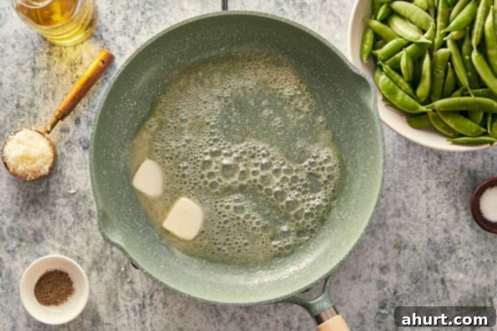 Keto Cacio e Pepe Delight 4 Melting butter and oil in a pan