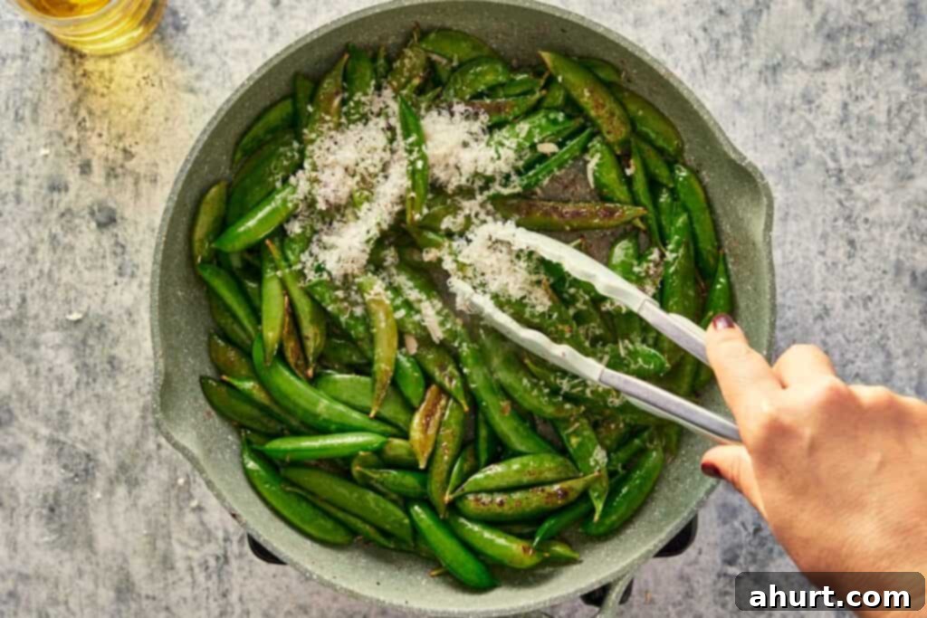 Keto Cacio e Pepe Delight 8 Adding Parmesan cheese