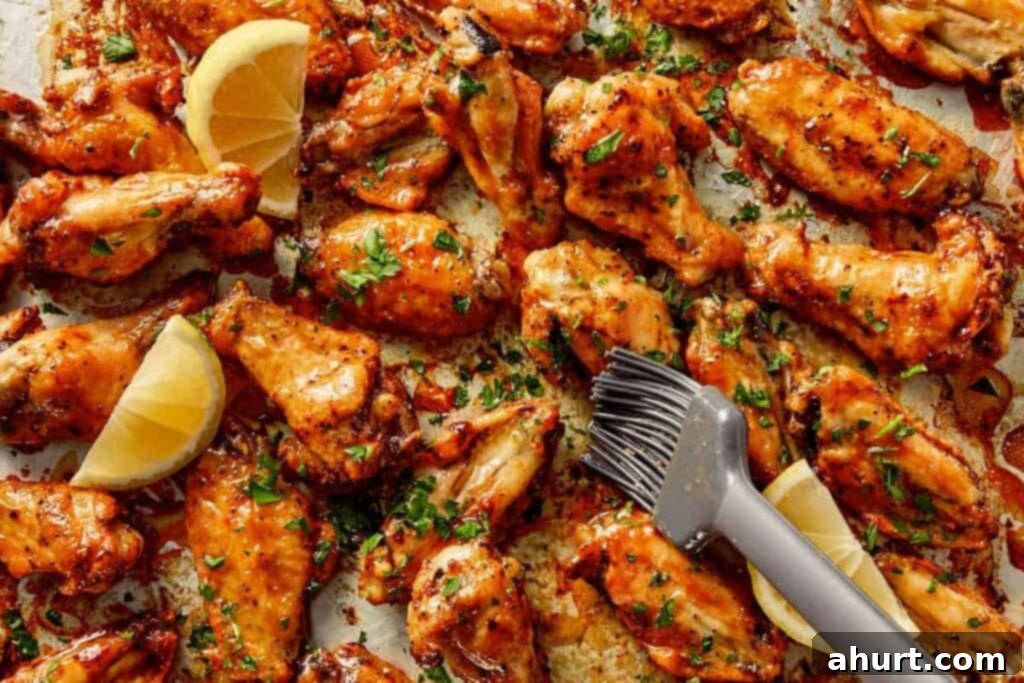 Lemon Pepper Wings: A Zesty Bite of Sunshine 11 Crispy lemon pepper chicken wings coated in butter sauce, garnished with parsley and served with lemon wedges