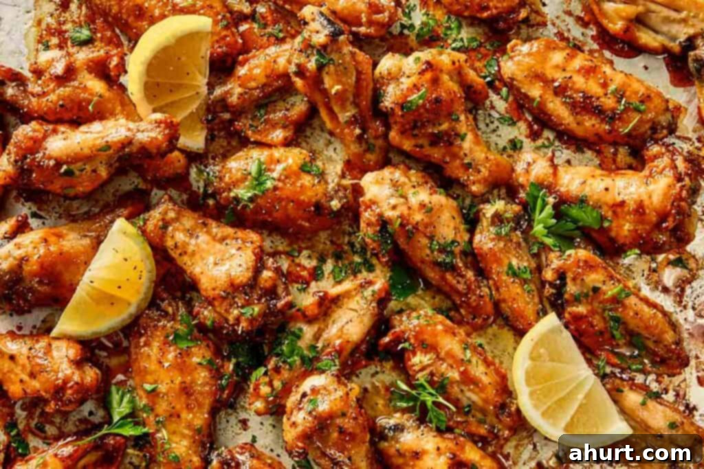 Lemon Pepper Wings: A Zesty Bite of Sunshine 12 Crispy lemon pepper chicken wings coated in buttery sauce, finished with fresh parsley and lemon wedges ready to serve