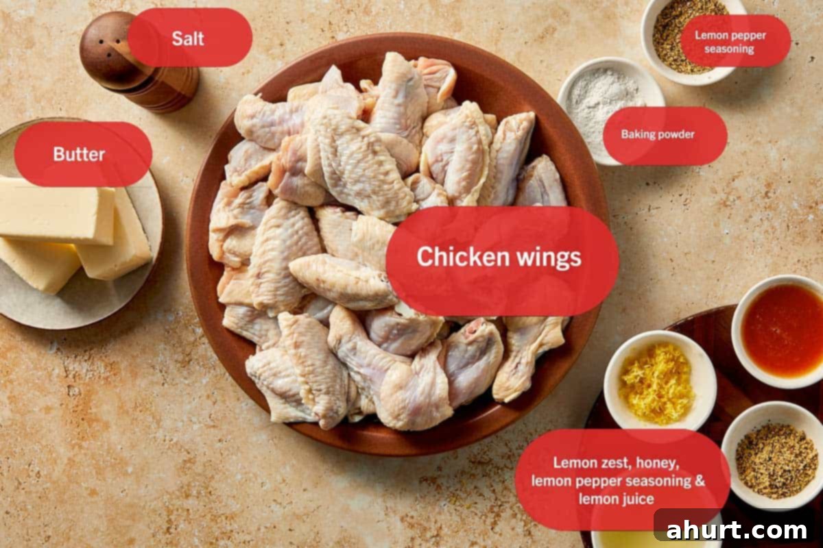 Lemon Pepper Wings: A Zesty Bite of Sunshine 4 Crispy lemon pepper chicken wings ingredients including raw chicken wings, butter, lemon pepper seasoning, baking powder, salt, lemon zest, honey, and lemon juice laid out on a table