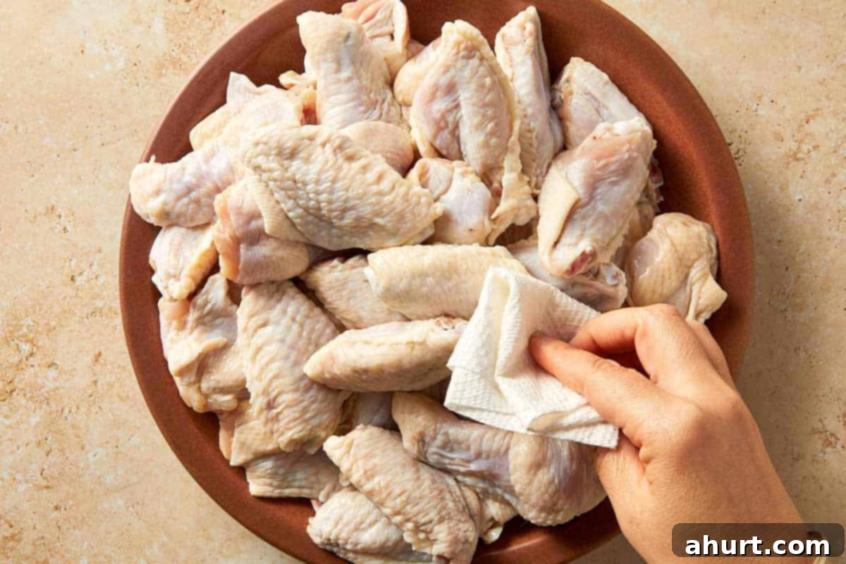 Lemon Pepper Wings: A Zesty Bite of Sunshine 5 Patting raw chicken wings dry with paper towels before seasoning to help them crisp up when cooking