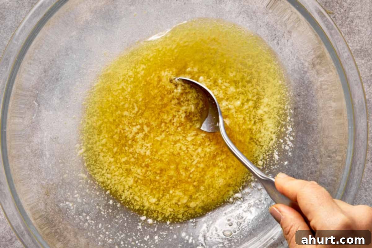 garlic butter sauce in bowl ready for tossing chicken wings